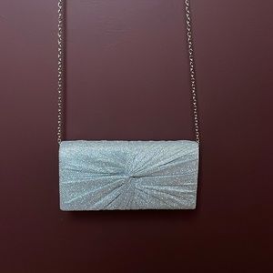 Silver shimmer evening bag with silver chain.